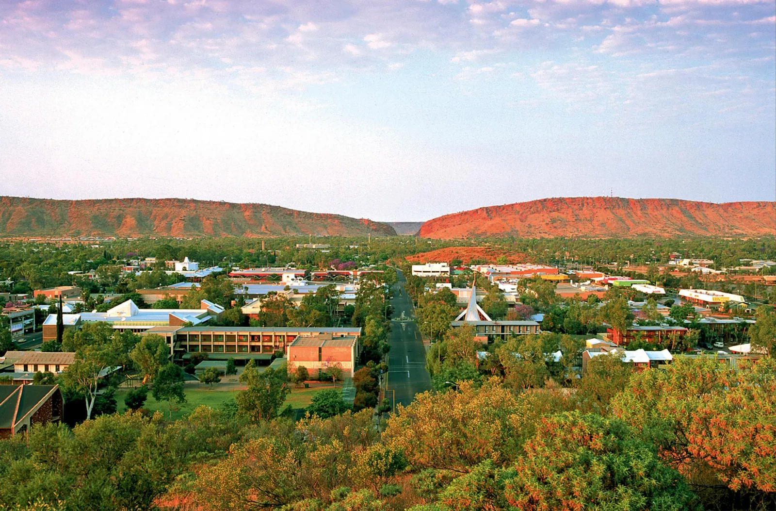 Alice Springs town center with the red MacDonnell Ranges and the gap in the hills behind it